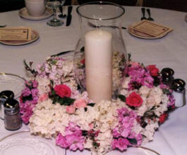 A floral wreath and candle centerpiece