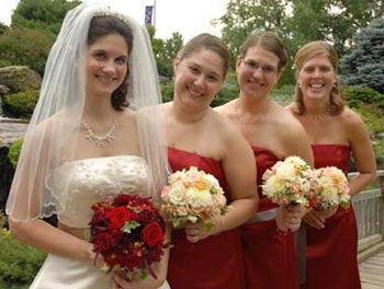 White bridal dress-red roses, red attendant dresses-white roses!